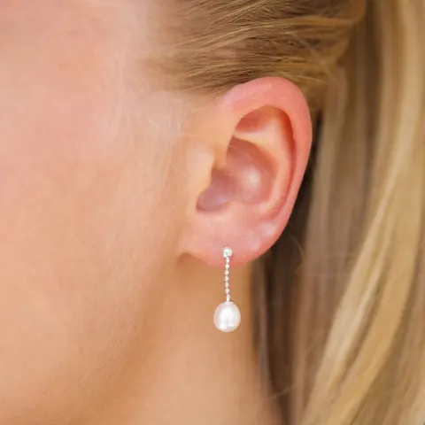 lange parel oorbellen in zilver