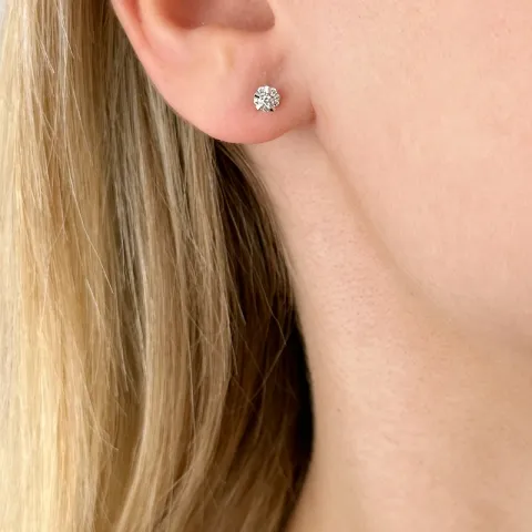 rond diamant oorsteker in 14 karaat witgoud met diamant en diamant 