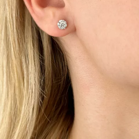 rond diamant oorsteker in 14 karaat witgoud met diamant en diamant 