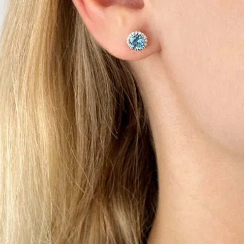 rond blauwe topaas diamant oorbellen in 14 karaat witgoud met diamant en topaas