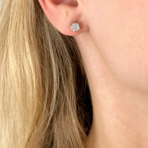 rond diamant oorsteker in 14 karaat witgoud met diamant