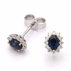 bloem saffier oorsteker in 14 karaat witgoud met diamant en saffier
