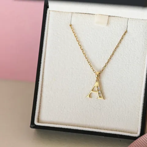Letter a hanger in 14 caraat goud 0,03 ct