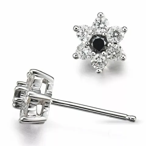 bloem diamant oorsteker in 14 karaat witgoud met diamant en zwart diamant