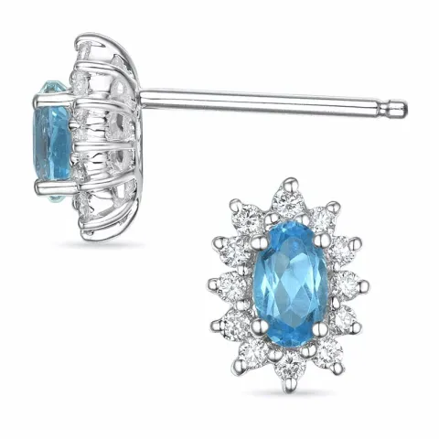 blauwe topaas rozetoorbel in 14 karaat witgoud met diamant en topaas