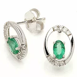 ovaal smaragd oorsteker in 14 karaat witgoud met diamant en smaragd 
