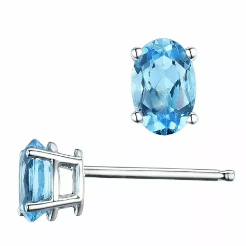 2 x 0,60 ct ovaal blauwe topaas oorsteker in 14 karaat witgoud met topaas