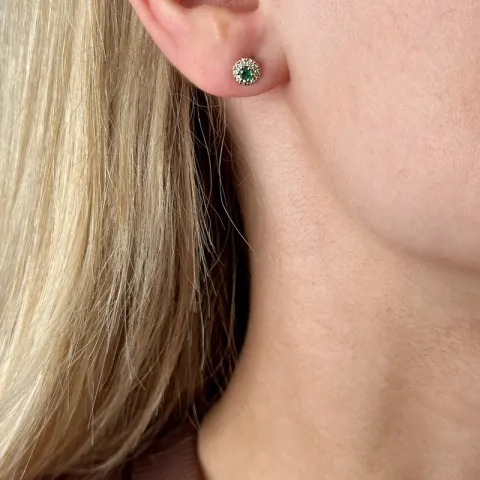 rond groene smaragd oorsteker in 14 karaat goud met diamant en smaragd