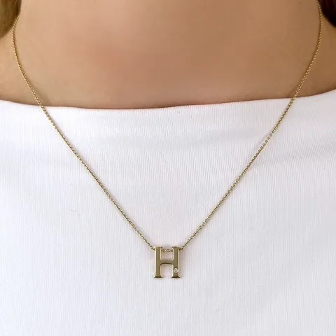 Letter h diamant hanger in 9 caraat goud 0,01 ct