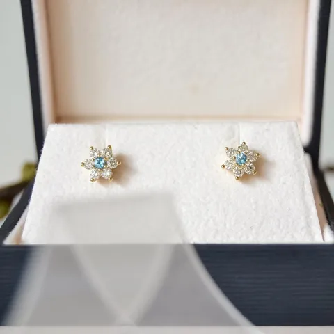 bloem topaas diamant oorbellen in 9 karaat goud met diamant en topaas
