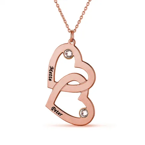 hart naamkettingen in zilver met een roze coating met 2 witte kristallen
