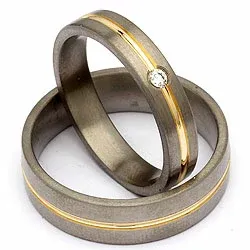 Trouwringen in titanium en goud 0,04 ct