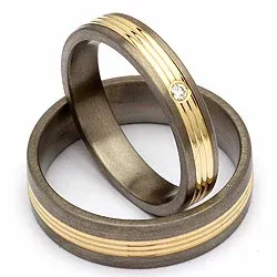 Trouwringen in titanium en goud 0,025 ct