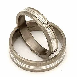 Trouwringen in 14 karaat titanium en goud 0,025 ct