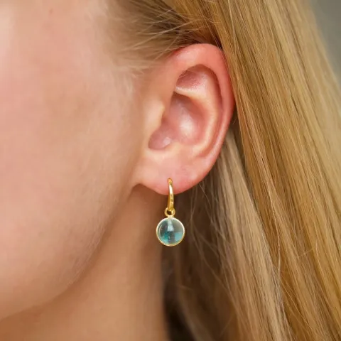 rond blauwe kristal oorbellen in verguld messing