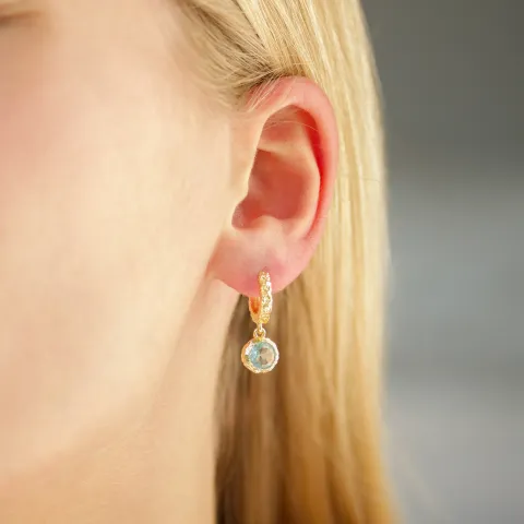 blauwe kristal creool in verguld messing - Eliné