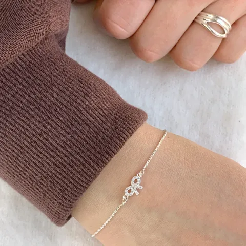 Strikje witte zirkoon armband in zilver