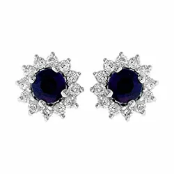 bloem blauwe saffier oorsteker in 14 karaat witgoud met saffier en diamant