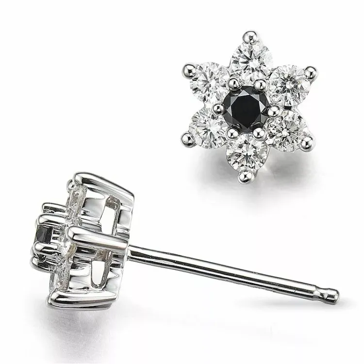 bloem diamant oorsteker in 14 karaat witgoud met diamant en zwart diamant