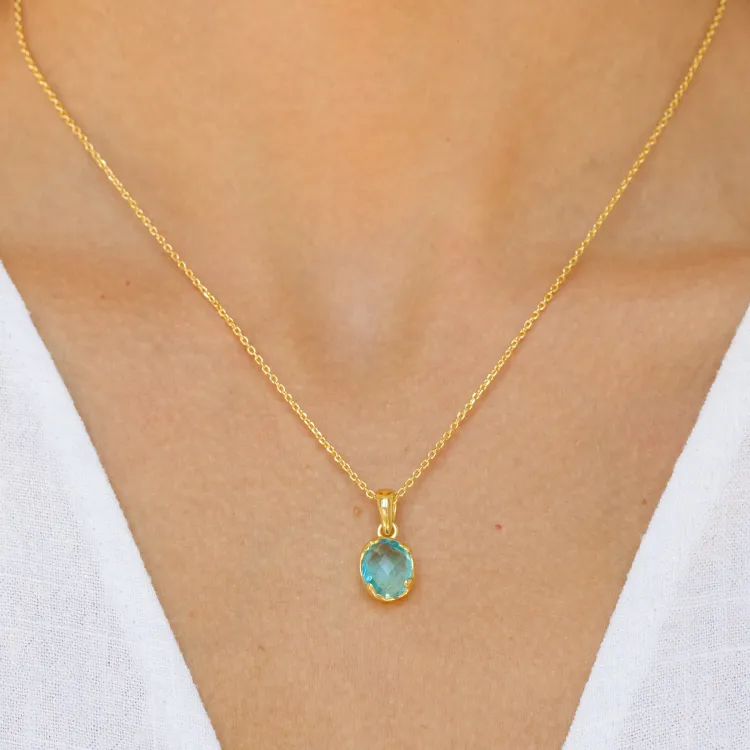 blauwe kristal ketting met hanger in verguld messing - Eliné