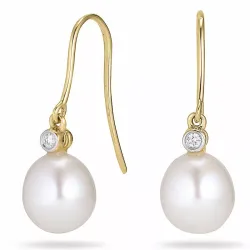 Ovaal 7 - 8 mm aaa-graded zoetwaterparel diamant oorbellen in 14 karaat goud met diamanten