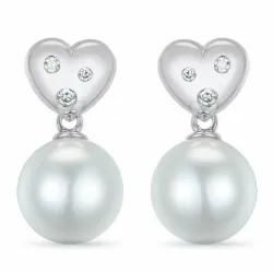 lange hart parel briljant oorbellen in 14 karaat witgoud met diamant 