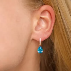 blauwe oorbellen in 9 karaat goud met syntetische topaas en zirkoon