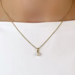 5 mm ivoorwit parel hanger in 9 karaat goud