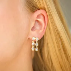 lange oorbellen in verguld messing - Eliné