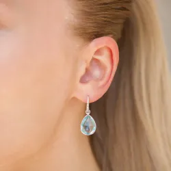 blauwe kristal oorbellen in verzilverd messing - Loom Stones